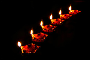 "Diya necklace Dipavali Diwali November 2013" by Ramnath Bhat - Flickr: Diya necklace. Licensed under CC BY 2.0 via Commons - https://commons.wikimedia.org/wiki/File:Diya_necklace_Dipavali_Diwali_November_2013.jpg#/media/File:Diya_necklace_Dipavali_Diwali_November_2013.jpg